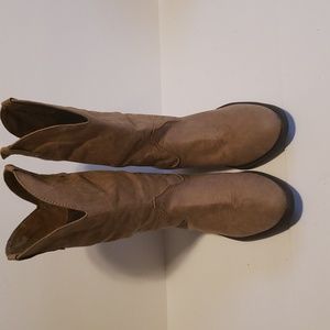 Fabric cowboy style boots with a rubber sole.